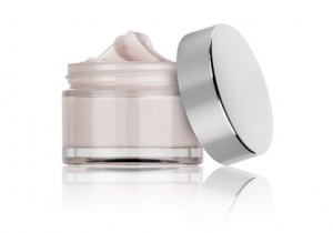 glass jar of beauty cream with cap, isolated